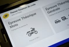 Student answering multiple-choice theory questions on a tablet at a La Poste exam center How to Get a Driving License in France
