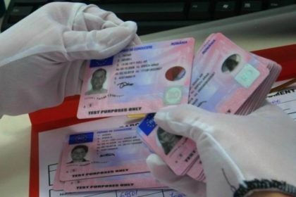 French Permis de Conduire driving license card resting next to auto-école study guide How to Get a Driving License in France