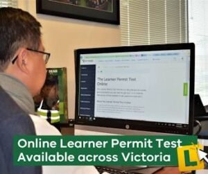 Applicant sitting at a computer terminal taking an Australian driver knowledge test for a learner permit